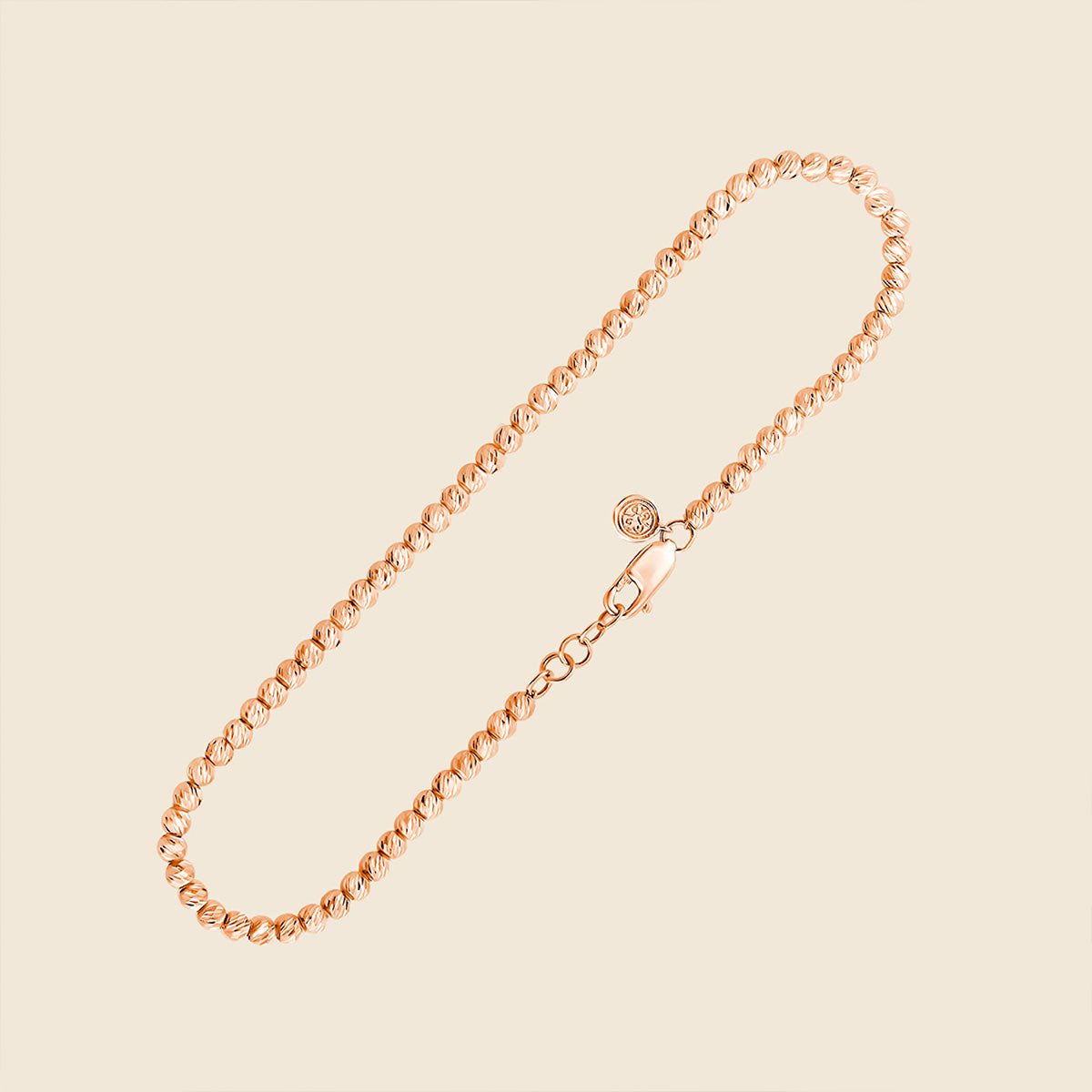 Armband aus kleinen Goldperlen mit besonderer Stuckatur in Rose