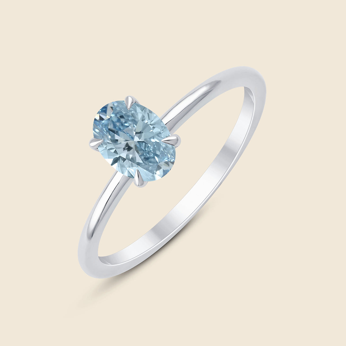 Weißgoldener Ring mit blauem Lab-Diamant im Ovalschliff