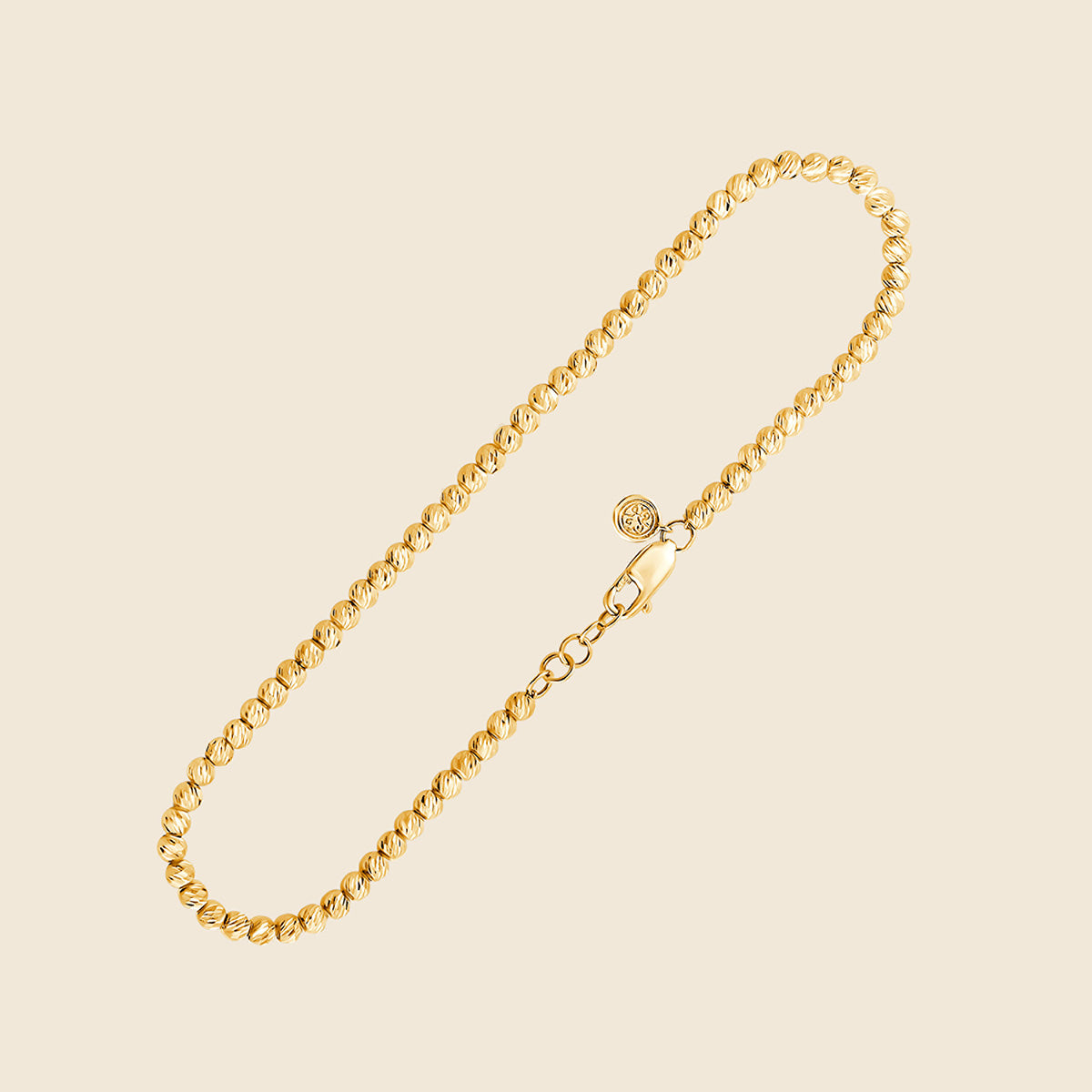 Armband mit kleinen durchgehenden Goldperlen in Gelbgold