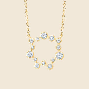 Kreisförmige Halskette aus Gelbgold mit im Wechsel angeordneten großen und kleinen Diamanten in Zargenfassung