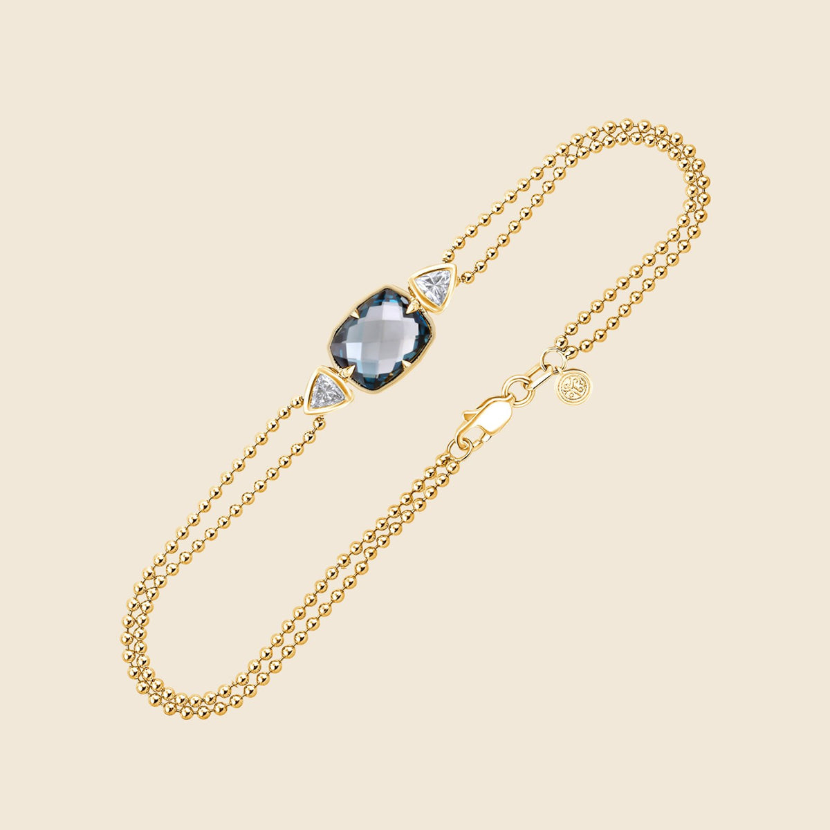 Gelbgoldenes Kugelketten-Armband mit London Blue Topas und zwei Trillion Lab Diamanten